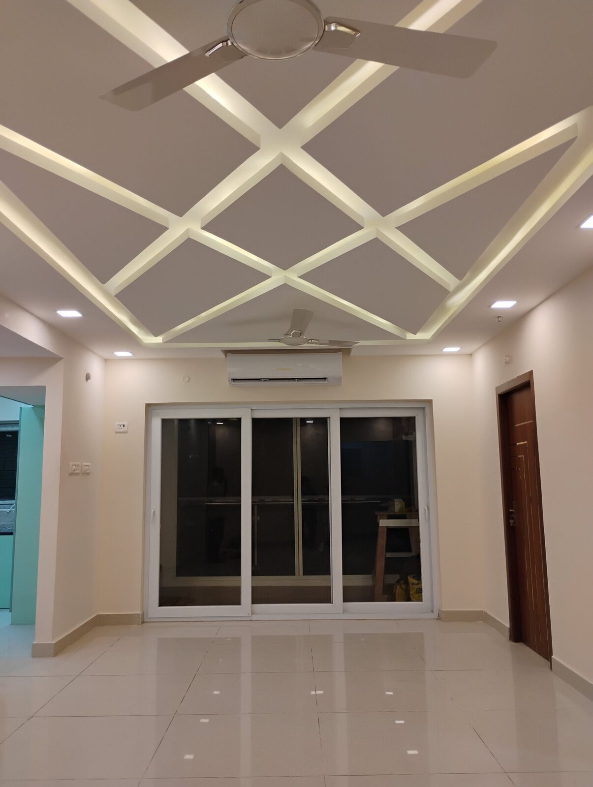 False ceiling with cove lighting and integrated air conditioning