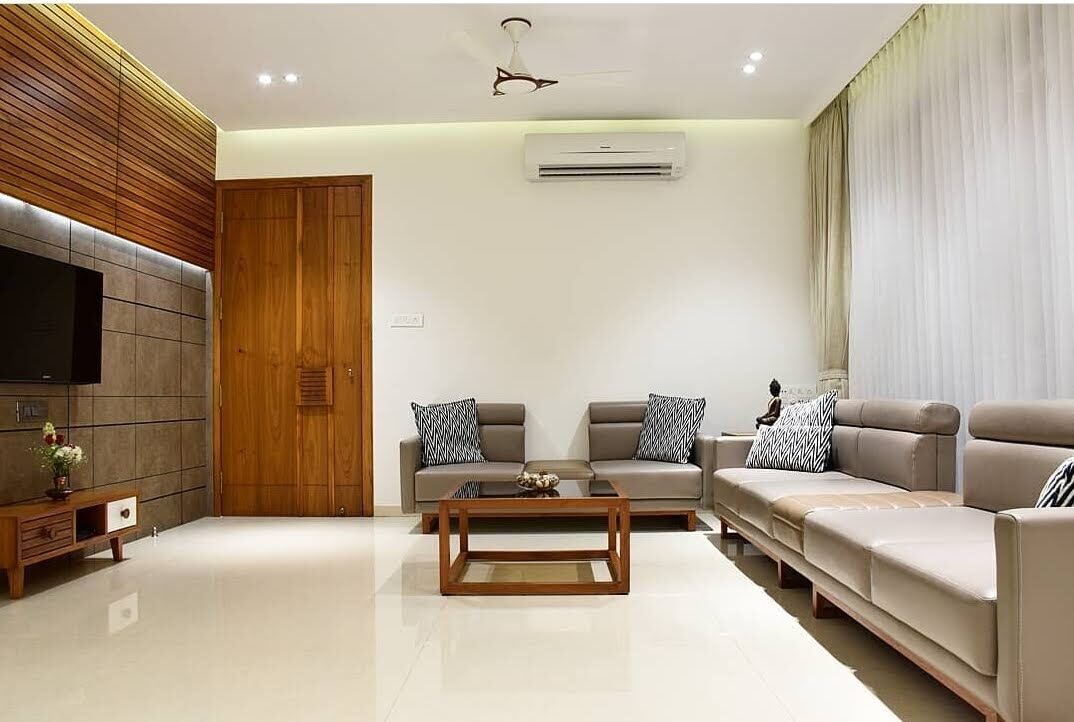 Living room with panelled TV wall and cove-lit false ceiling